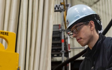 Ronald Reagan Sailors Charge Electronically Enclosed Forklift