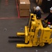 Ronald Reagan Sailors Charge Electronically Enclosed Forklift