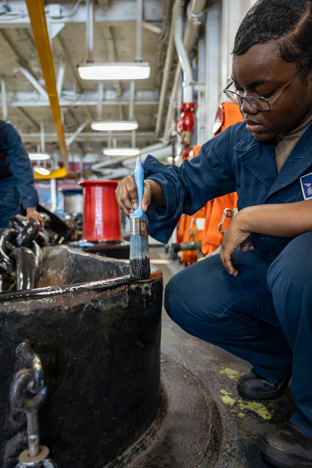 USS Iwo Jima Sailors Paint The Hawsepipe