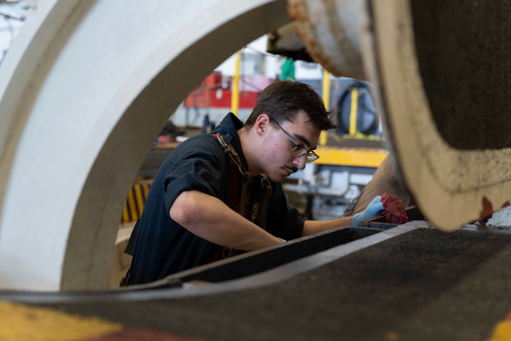 Abraham Lincoln conducts routine maintenance