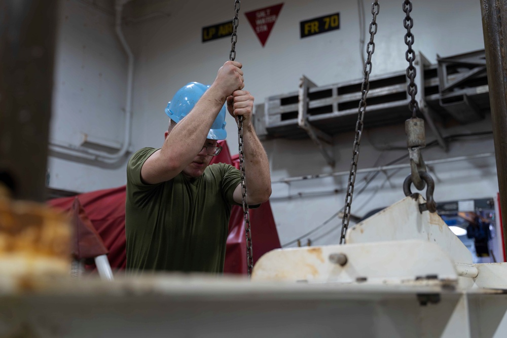 Abraham Lincoln conducts routine maintenance