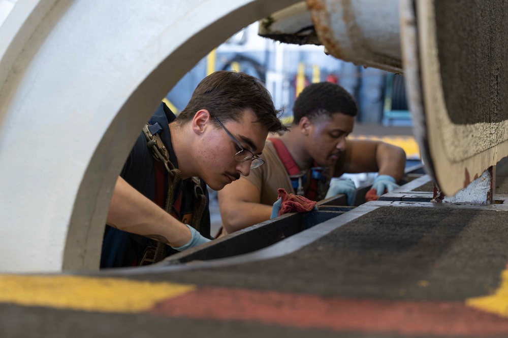 Abraham Lincoln conducts elevator maintenance