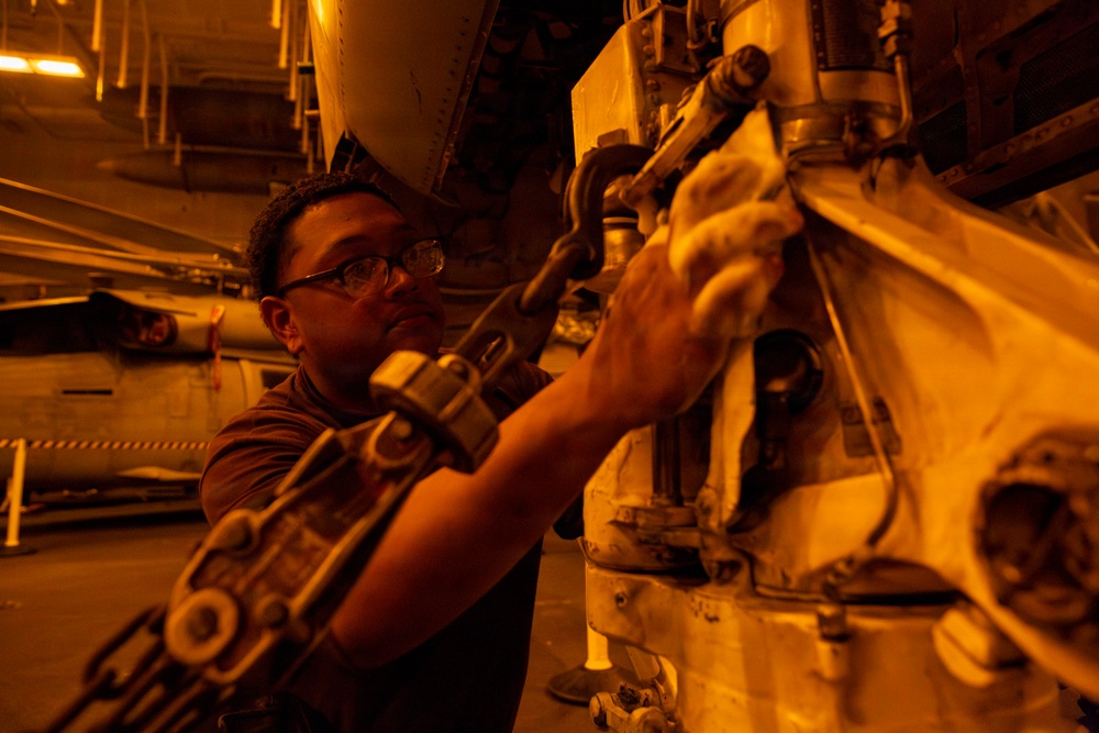 Abraham Lincoln conducts routine aircraft maintenance