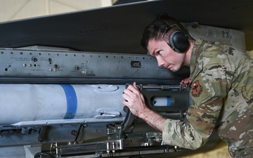 849th Aircraft Maintenance Squadron Airmen load weapons onto F-16 Fighting Falcons during monthly training