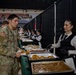 A Mississippi Army National Guard Soldier receives food during a holiday luncheon