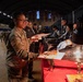 A Mississippi Army National Guard Soldier receives food during a holiday luncheon