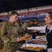 A Mississippi Army National Guard Soldier receives food during a holiday luncheon