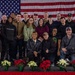 U.S. National Guard service members take a photo together during a holiday luncheon
