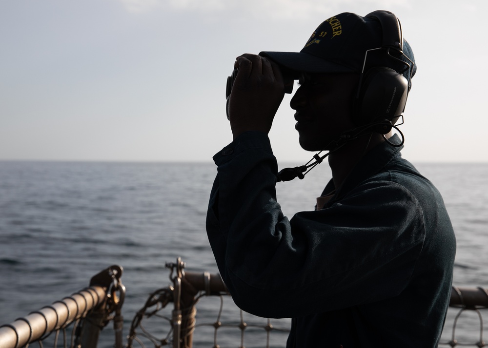 USS Mitscher (DDG 57) Sailor stands aft lookout watch on flight deck