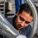 USS Mitscher (DDG 57) Sailor conducts maintenance on LPAD