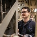 USS Mitscher (DDG 57) Sailor logs readings in engine room