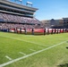 Coast Guard performs an oath of enlistment during the Armed Forces Bowl