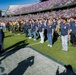 Coast Guard performs an oath of enlistment during the Armed Forces Bowl