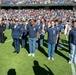 Coast Guard performs an oath of enlistment during the Armed Forces Bowl