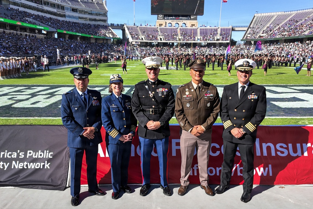 Coast Guard performs an oath of enlistment during the Armed Forces Bowl