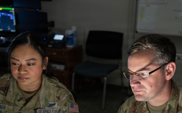 Space Force Guardians assigned to Space Delta 5 monitor a computer workstation.