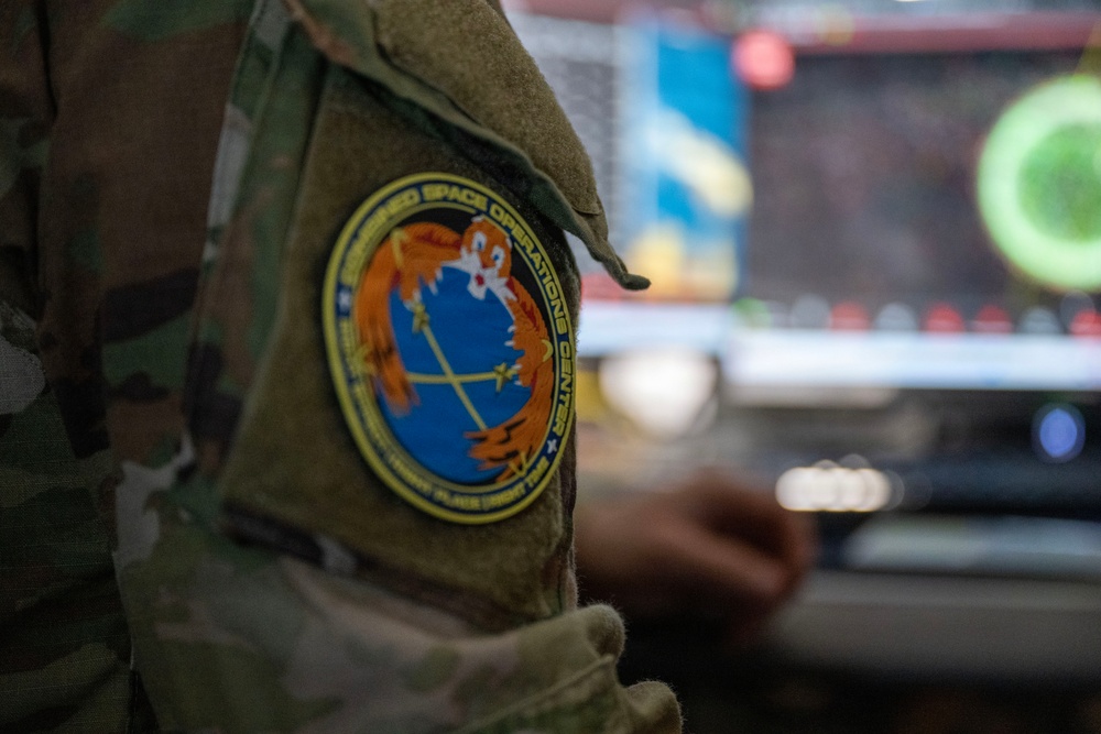 Space Force Guardian assigned to the Combined Space Operations Center monitors a computer workstation.