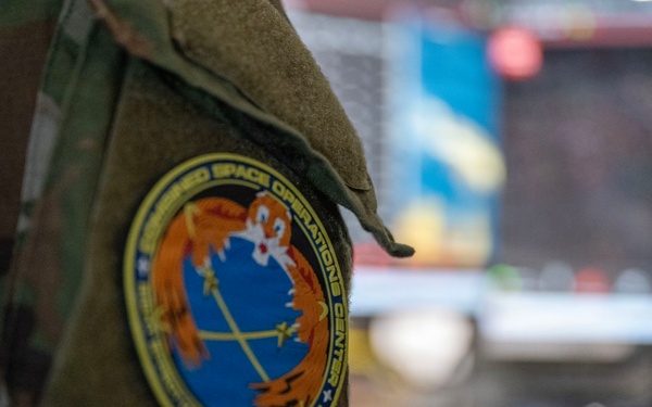 Space Force Guardian assigned to the Combined Space Operations Center monitors a computer workstation.