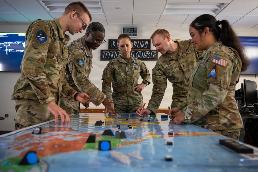 Space Force Guardians assigned to Space Delta 5 conduct military planning.