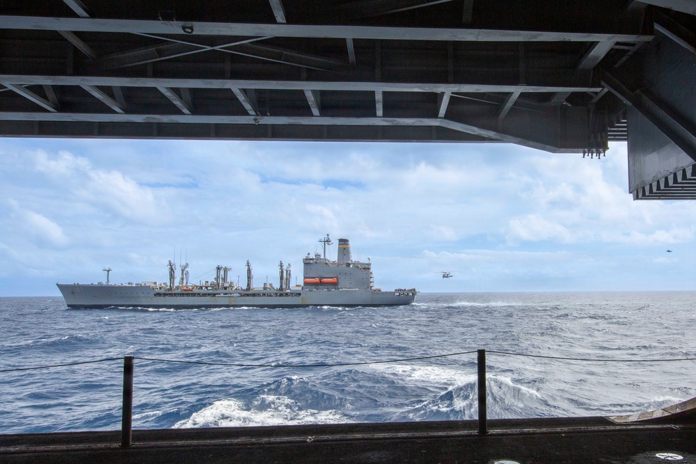 Abraham Lincoln conducts a replenishment-at-sea with Henry J. Kaiser