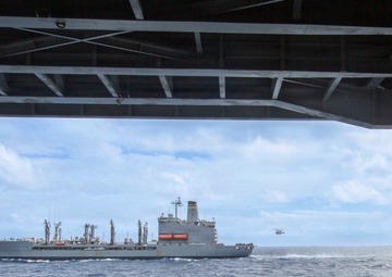 Abraham Lincoln conducts a replenishment-at-sea with Henry J. Kaiser