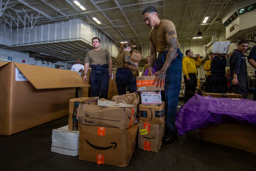 Abraham Lincoln conducts a replenishment-at-sea with Henry J. Kaiser