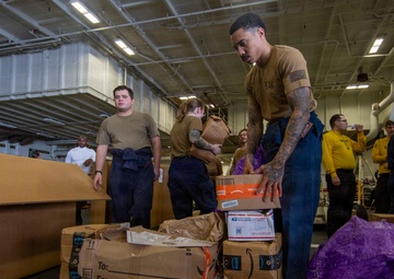 Abraham Lincoln conducts a replenishment-at-sea with Henry J. Kaiser