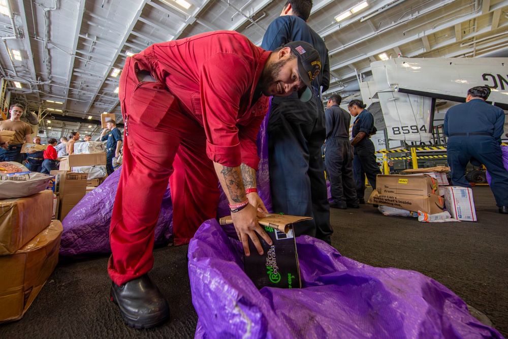 Abraham Lincoln conducts a replenishment-at-sea with Henry J. Kaiser