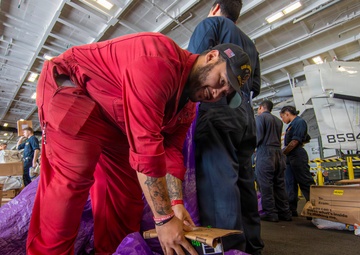Abraham Lincoln conducts a replenishment-at-sea with Henry J. Kaiser