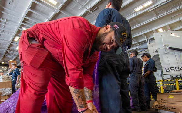 Abraham Lincoln conducts a replenishment-at-sea with Henry J. Kaiser