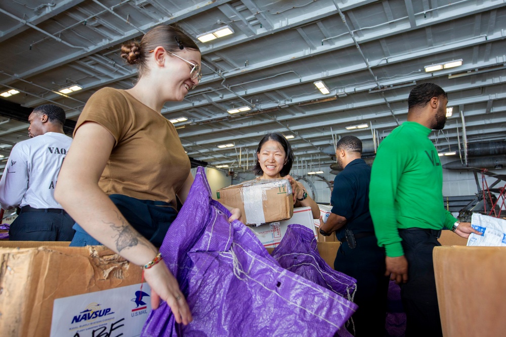 Abraham Lincoln conducts a replenishment-at-sea with Henry J. Kaiser