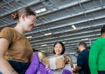 Abraham Lincoln conducts a replenishment-at-sea with Henry J. Kaiser