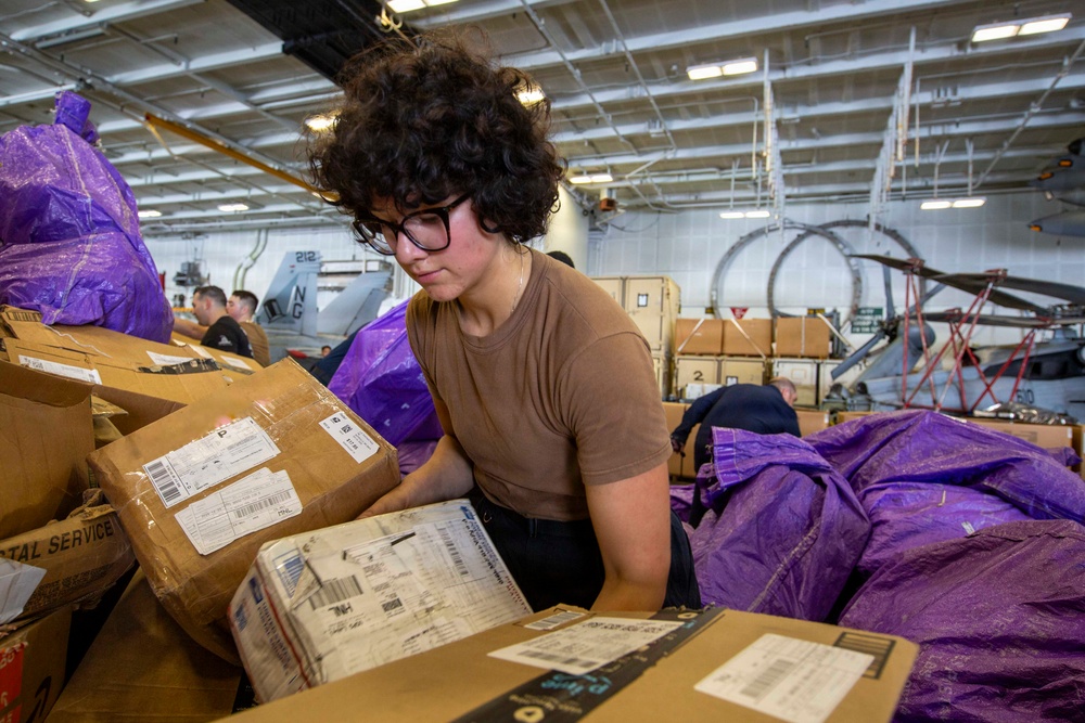 Abraham Lincoln conducts a replenishment-at-sea with Henry J. Kaiser