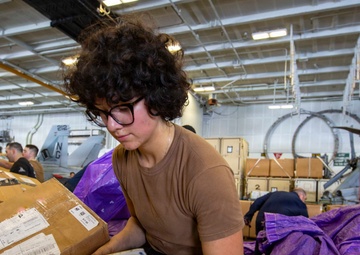 Abraham Lincoln conducts a replenishment-at-sea with Henry J. Kaiser