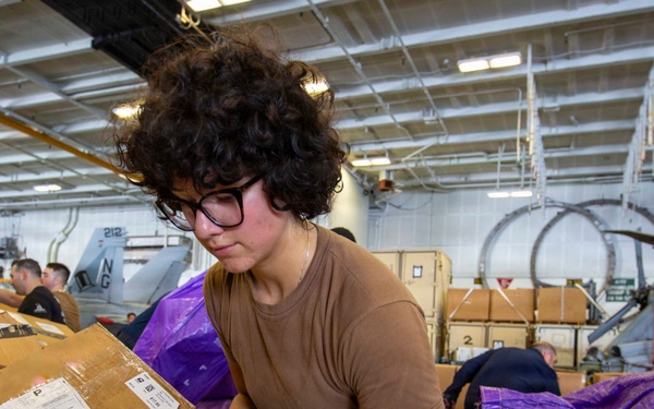 Abraham Lincoln conducts a replenishment-at-sea with Henry J. Kaiser