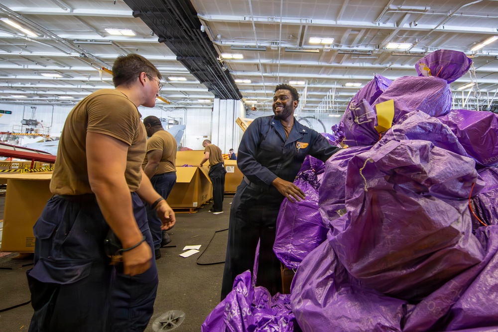 Abraham Lincoln conducts a replenishment-at-sea with Henry J. Kaiser