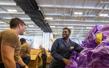 Abraham Lincoln conducts a replenishment-at-sea with Henry J. Kaiser