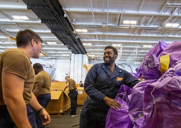 Abraham Lincoln conducts a replenishment-at-sea with Henry J. Kaiser