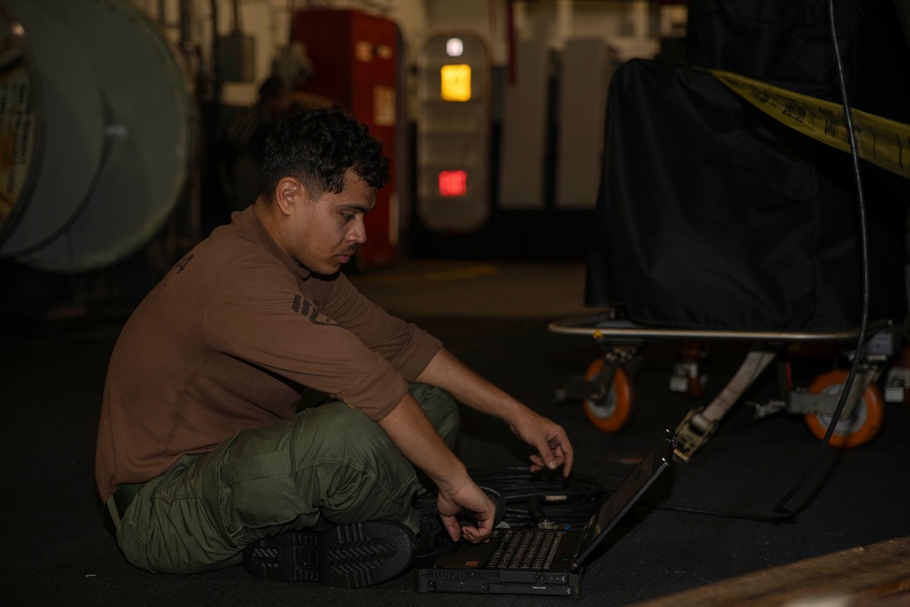Abraham Lincoln conducts routine aircraft maintenance