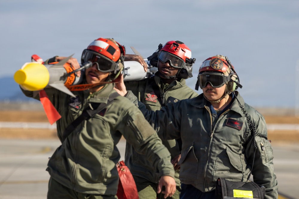 U.S. Marines perform ordnance loading and refueling