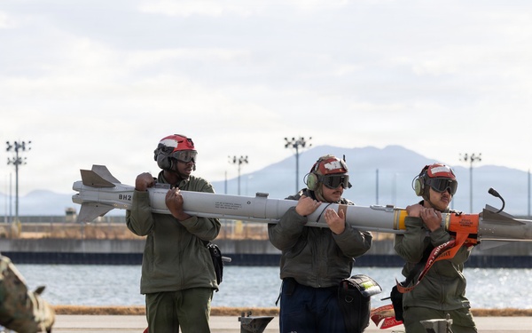 U.S. Marines perform ordnance loading and refueling