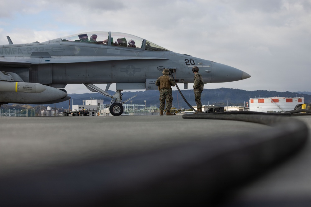 U.S. Marines perform ordnance loading and refueling