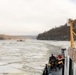Coast Guard Cutter Cleat escorts a tug through semi-frozen waters.