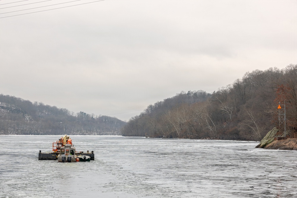 Coast Guard Cutter Cleat escorts a tug through semi-frozen waters.