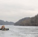 Coast Guard Cutter Cleat escorts a tug through semi-frozen waters.