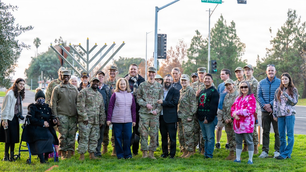 Team Travis celebrates Hanukkah with menorah lighting ceremony