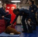 Expeditionary facility dog visits Sailors aboard Abraham Lincoln