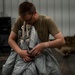 82nd ERQS Airman prepares parachutes for regional operations