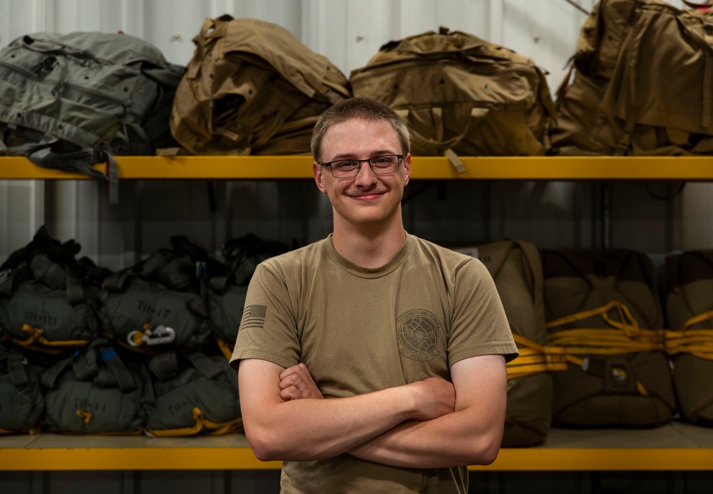 82nd ERQS Airman prepares parachutes for regional operations