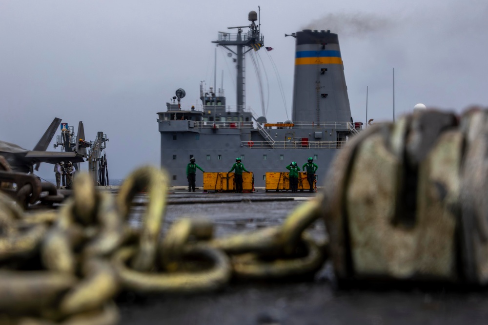 Abraham Lincoln conducts a replenishment-at-sea with Henry J. Kaiser and Cesar Chavez